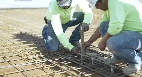 Workers install and secure rebar to reinforce the concrete slab during the Union, NJ parking garage restoration project